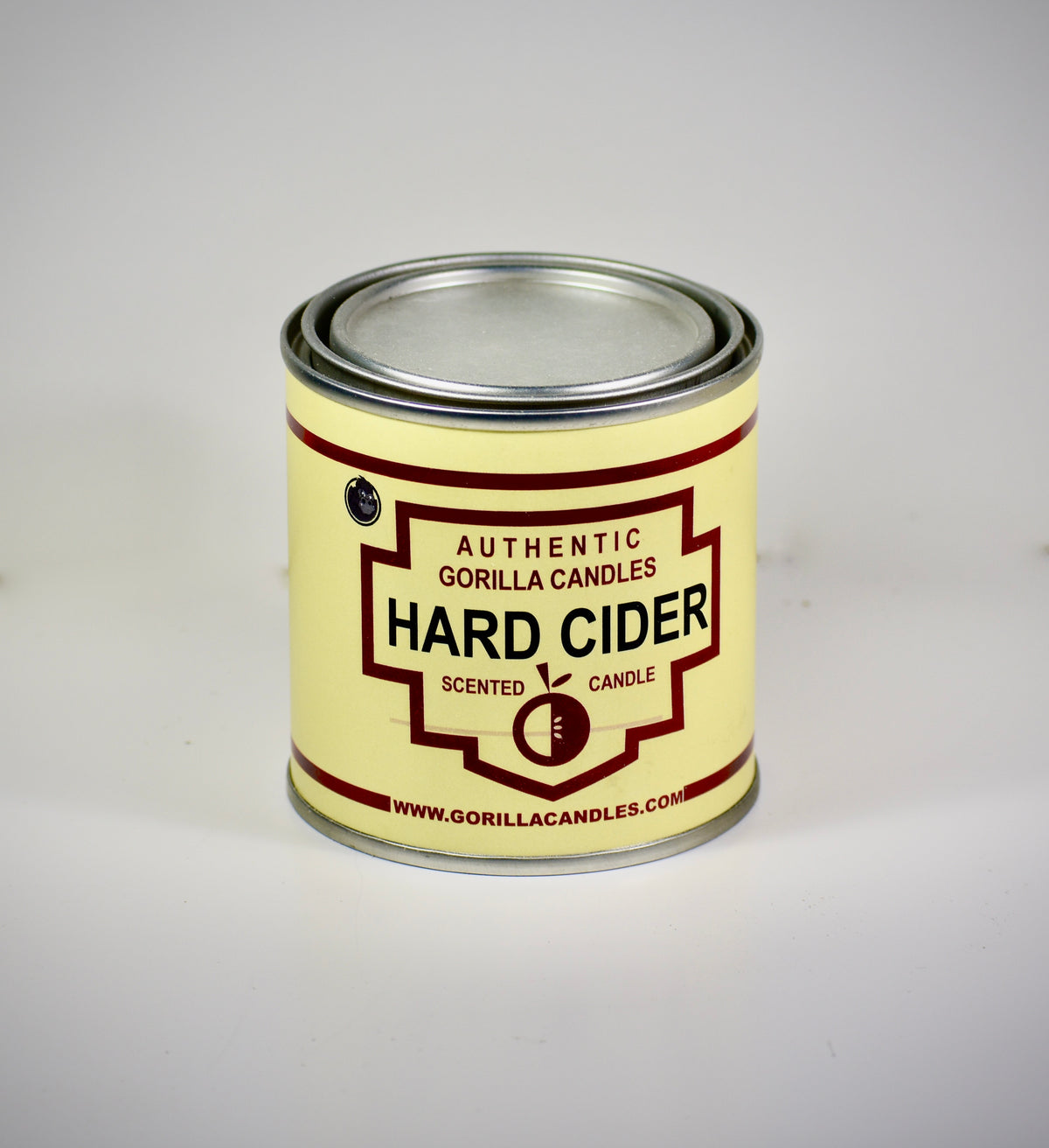 Front view of Hard Cider candle in a metal tin with white labeling