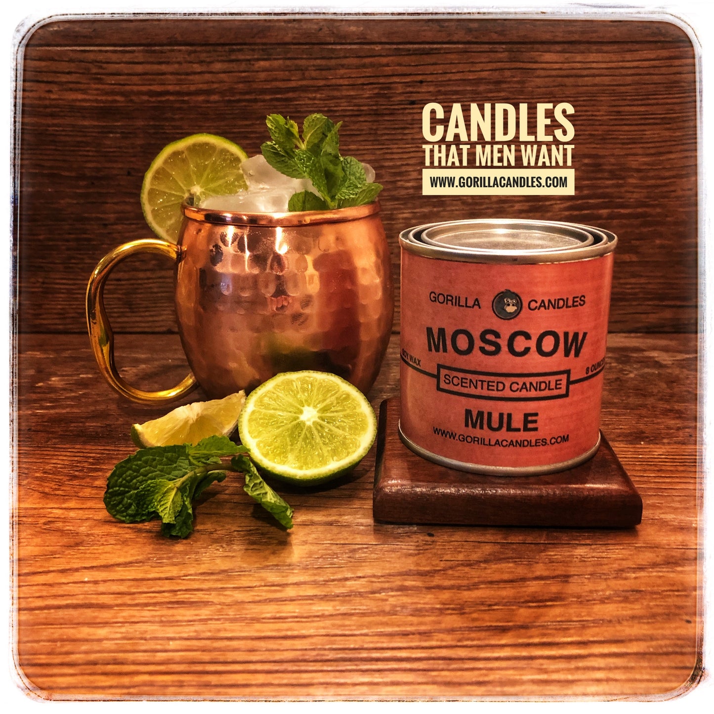 Moscow mule candle in a brass tin next to a prepared Moscow Mule drink