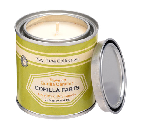 Front view of Gorilla Farts candle in a metal tin with a green label.
