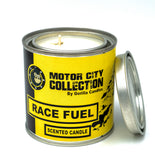 Front view of Race Fuel candle in a metal tin with a yellow label