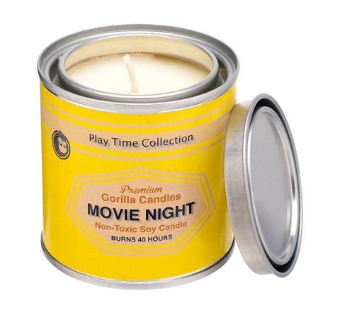 Movie Night candle in a tin with a yellow label around it.