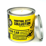 Front view of Gorilla Candles leather interior candle in a metal tin with a yellow label 