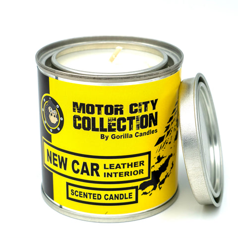 Front view of Gorilla Candles leather interior candle in a metal tin with a yellow label 