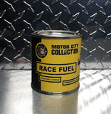 Extended view of Race Fuel candle with metal design in the background