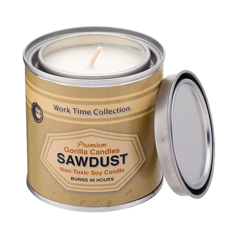 Opened Sawdust Candle with cream colored label over metal tin. 