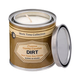Front view of open Dirt candle in a metal tin with light brown label